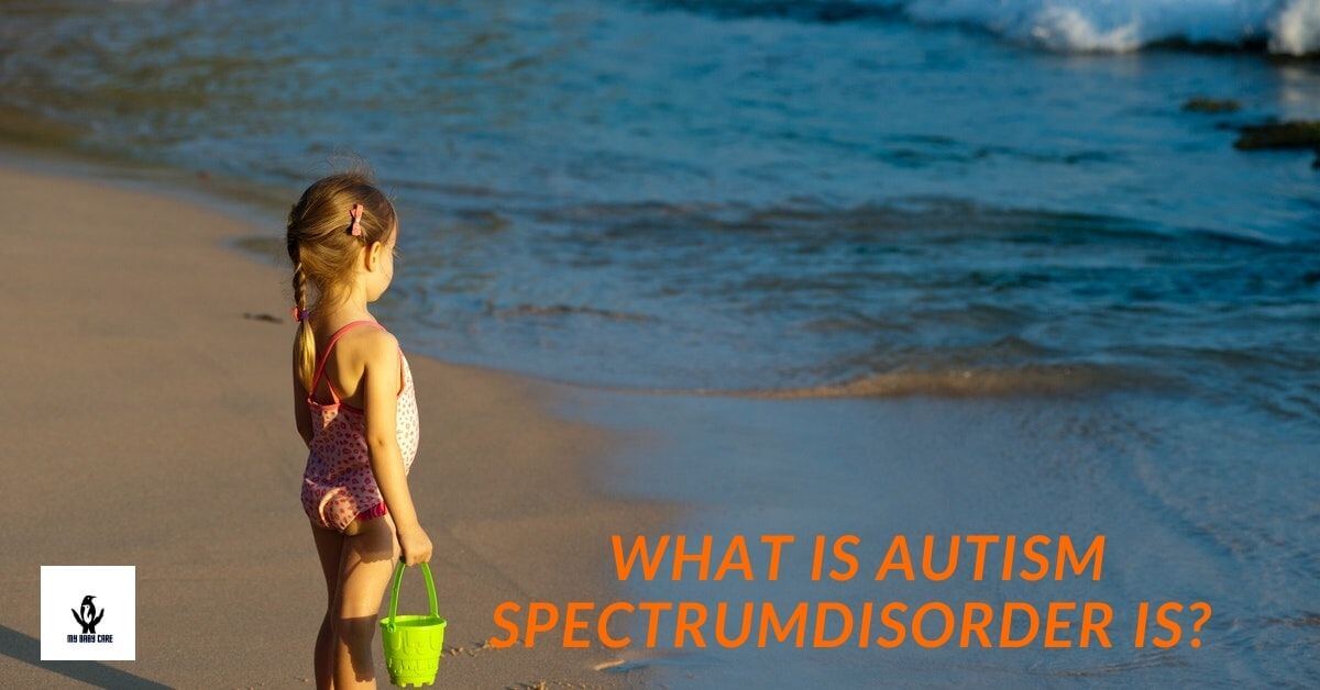 Adorable baby girl is standing at a beach