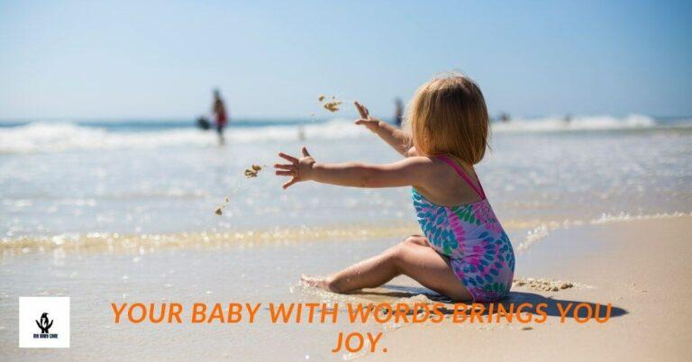 Adorable toddler playing in the beach