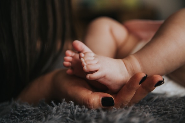 baby in the room with mom.