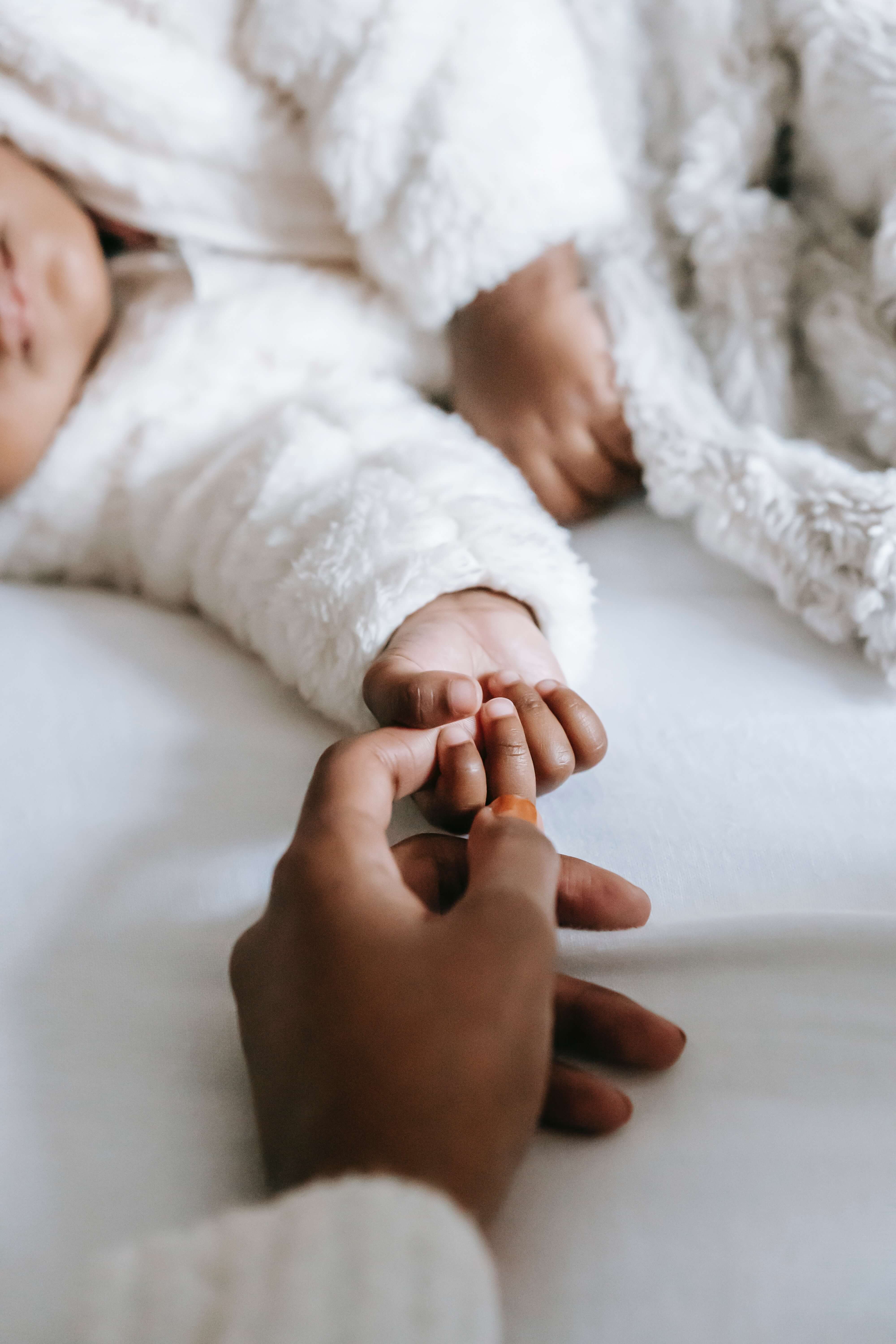 baby with cleched fist