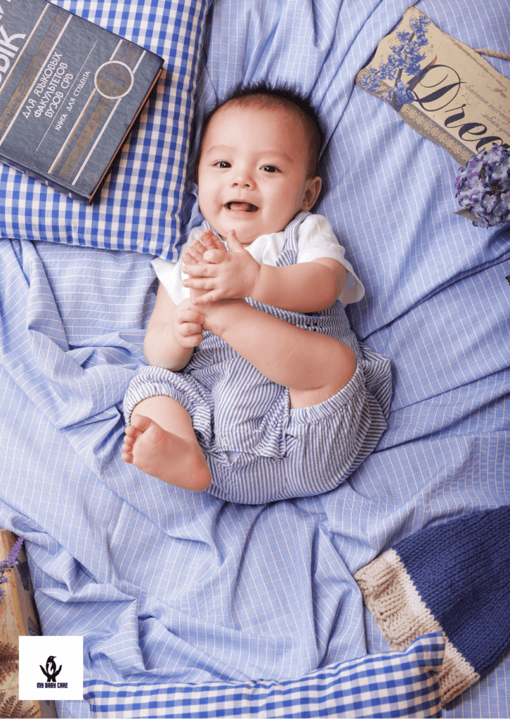 cute baby isrubbing his feet by himself