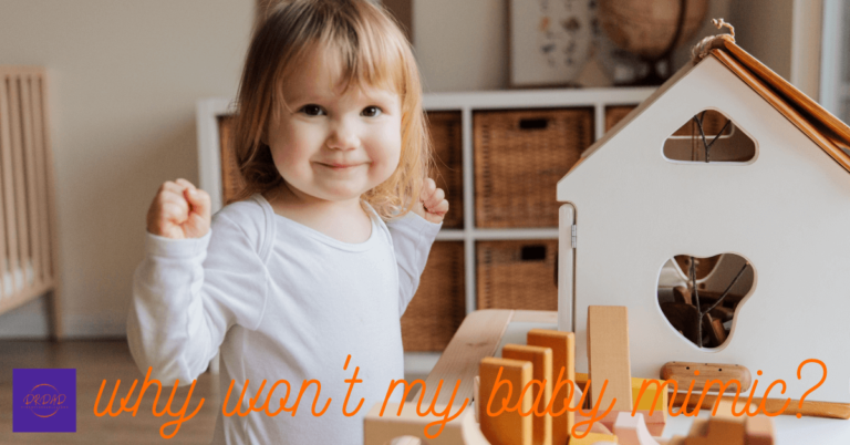 Adorable baby plays with toys