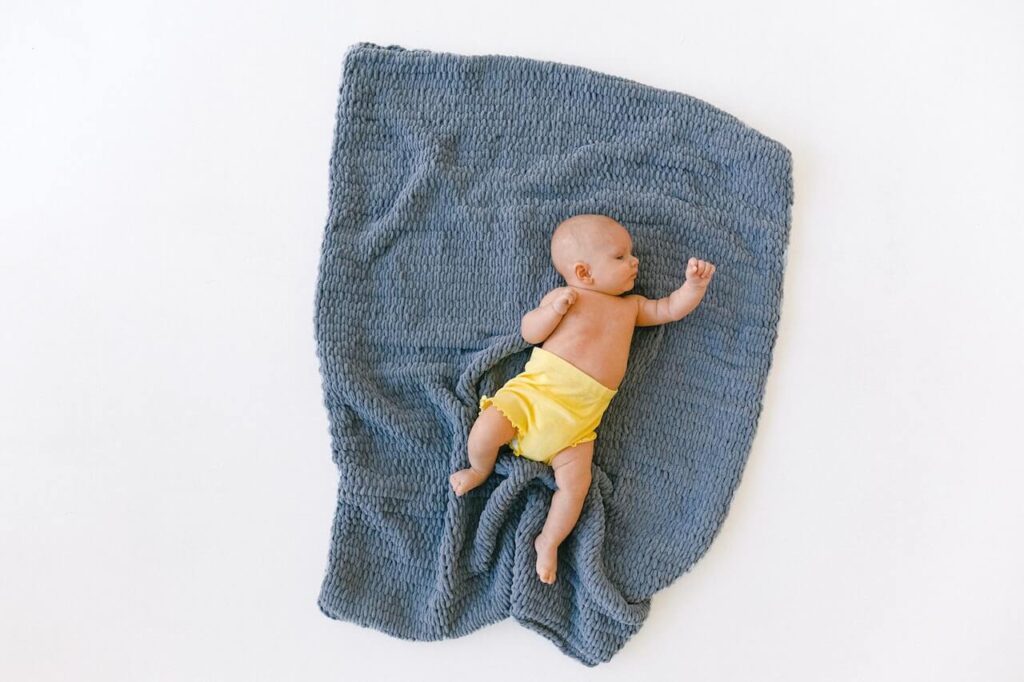 Adorable baby sleep on a blanket